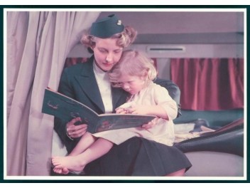 Stewardess with girl, cabin